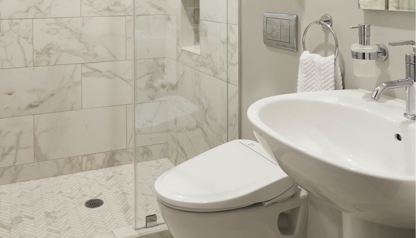 5 Design Elements To Make Your Bathroom Remodel Timeless - Bathroom Renovation - Herringbone tile - Custom Kitchens